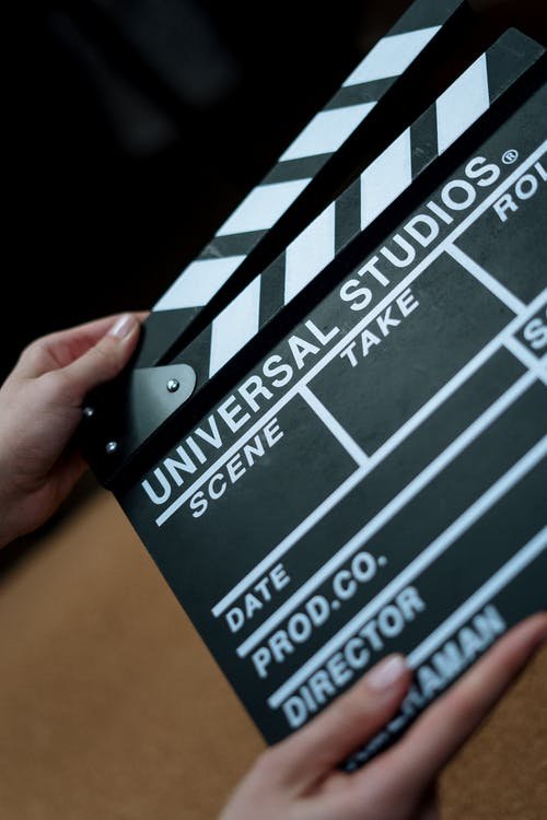 person holding Universal Studios clapboard